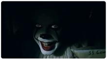 Pennywise looks out from the sewer.